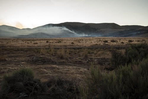 Chris Detrick  |  The Salt Lake Tribune
Fire burns west of Utah Lake and south of Saratoga Springs along State Road 68 Thursday May 31, 2012. No homes or structures have been threatened as of Thursday evening.