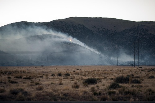 Chris Detrick  |  The Salt Lake Tribune
Fire burns west of Utah Lake and south of Saratoga Springs along State Road 68 on Thursday, May 31, 2012.