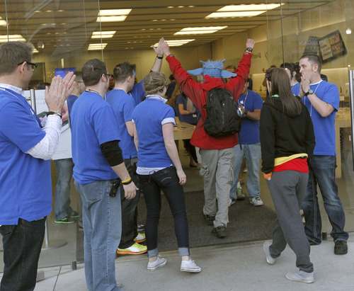 Al Hartmann  |  The Salt Lake Tribune
Apple fans lined up in front of the Apple Store at The Gateway in Salt Lake City early Friday to be among the first to buy the the iPad 3. The store is moving to City Creek Center at the end of the year.