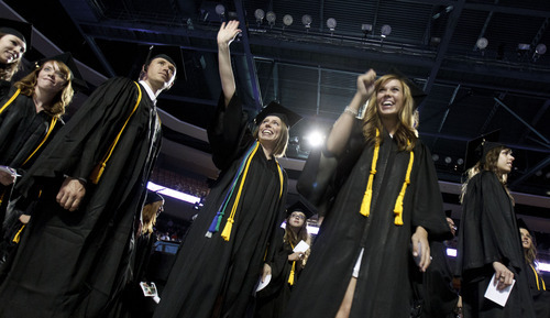 Trent Nelson  |  The Salt Lake Tribune
Graduates wave to family and friends during the Processional at Westminster College's Commencement Saturday, June 2, 2012 at the Maverik Center in West Valley City.