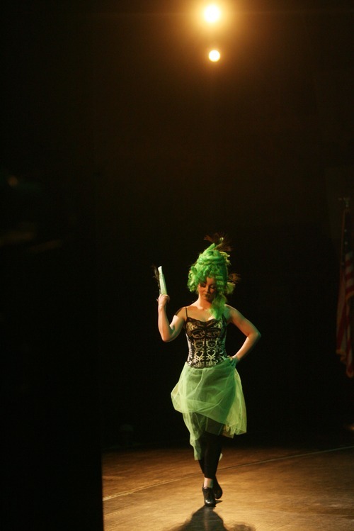 Kim Raff | The Salt Lake Tribune
A model walks onstage during the Inside the Rainbow display during the Avalon School of Cosmetology's Fantasy Hair Show at Peery's Egyptian Theater in Ogden on Saturday, June 2, 2012.