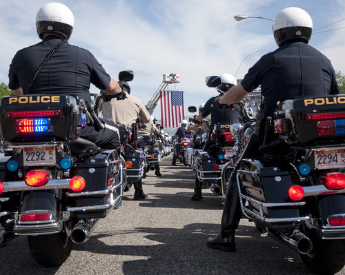 Michael Mangum  |  Special to the Tribune

Police and state troopers take to the street at the beginning of the 61st Annual Wendover MDA Ride on State Street near the Harley-Davidson of Salt Lake City shop on Sunday, June 3, 2012. Joe Timmons, the shop's owner, estimates that over 2000 bikers participated in the ride, which is geared toward raising funds for the Muscular Dystrophy Association in Utah.