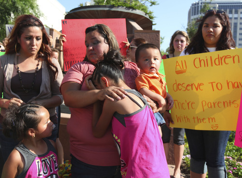 Lennie Mahler  |  The Salt Lake Tribune
Laura Avelar comforts her niece, Abigail, during a press conference held north of the LDS Temple with family and friends of the Avelars on Monday, June 4, 2012. The Avelar sisters face deportation June 15 that would split their families.