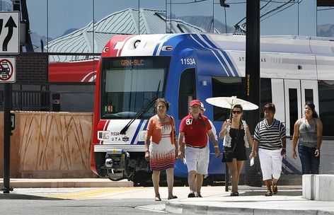 Scott Sommerdorf  |  Tribune File Photo
A family on its way to shop across the street at the Valley Fair Mall passes by a TRAX train last year as it leaves the West Valley Central Station, 2750 W. 3590 South.