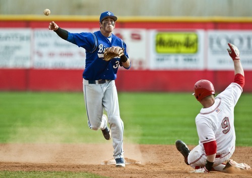 Chris Detrick  |  The Salt Lake Tribune
Bingham's Brady Lail (3) forces out Spanish Fork's Kayden Porter (9) at second base during the game at Spanish Fork High School Thursday March 29, 2012. Bingham won the game 4-0.