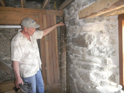 Tom Wharton  |  The Salt Lake Tribune
Homeowner Tom Owens examines a piece of the original 1860 mill at the home he is restoring in Farmington.
