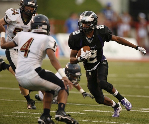 Trent Nelson  |  The Salt Lake Tribune
Riverton's Stratton Brown runs for yardage. Herriman vs. Riverton High School football at Rice-Eccles Stadium in Salt Lake City, Utah, Saturday, August 27, 2011.