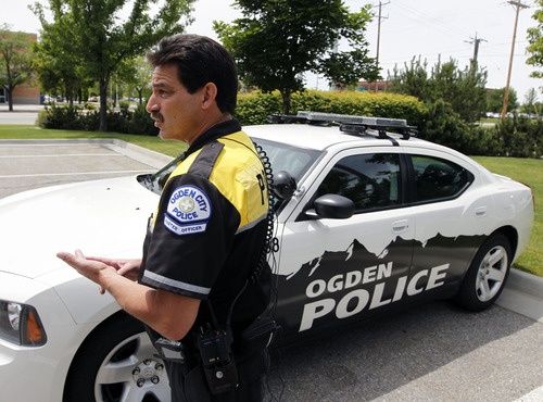 Al Hartmann  |  The Salt Lake Tribune 
Ogden Police master officer Tim Shelstead operates this specially equipped Ogden police car that can read license plates in real time with its four rooftop cameras.   	Agencies around the state are using license plate scanners to aid highway and street patrol cars in apprehending criminals.   They can determine if the car's registration and insurance is up to date.