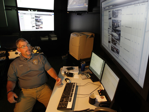 Al Hartmann  |  The Salt Lake Tribune 
Ogden Police crime analyst Dave Weloth reads a license plate history of one particlar truck in the Real Time Crime Center.  The plate has been scanned over several days by a specially equipped Ogden police car that can read license plates with its four roof mounted cameras.   	Agencies around the state are using license plate scanners to aid highway and street patrol cars in apprehending criminals.   They can determine if the car's registration and insurance is up to date.