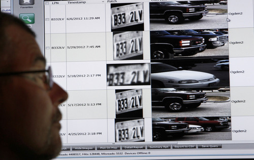 Al Hartmann  |  The Salt Lake Tribune 
Ogden Police crime analyst Dave Weloth reads a license plate history of one particlar truck in the Real Time Crime Center.  The plate has been scanned over several days by a specially equipped Ogden police car that can read license plates with its four roof mounted cameras.   	Agencies around the state are using license plate scanners to aid highway and street patrol cars in apprehending criminals.   They can determine if the car's registration and insurance is up to date.