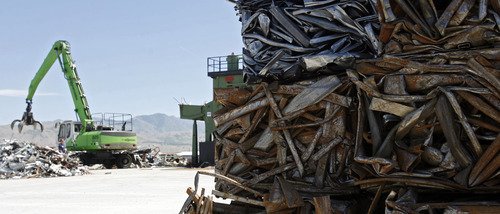 Francisco Kjolseth  |  The Salt Lake Tribune
A large claw picks up steel to be sheared and compressed into small bundles as State officials and business executives meet to open the recycling bay at Metro Group's newest state-of-the-art recycling facility located in Salt Lake City at 3150 West 900 South on Thursday, May 31, 2012. The facility processes all varieties of metals and paper products.