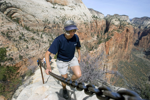 Al Hartmann  |  Tribune file photo
A hiker carefully makes her way up the Angels Landing Trail in Zion National Park. As part of Saturday's National Get Outdoors Day, admission to all national parks is free.