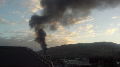 Thick, black smoke pours into the northern skies of Salt Lake City from an early Saturday morning fire near the Tesoro Corp. refinery. (Bob Mims/The Salt Lake Tribune)