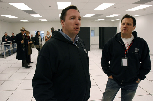 Francisco Kjolseth  |  The Salt Lake Tribune    
West Valley City - Ben Bush, left, president of Voonami, an Orem-based provider of computing power and Ralph Yarro, it's CEO discuss the intricacies of their new computer center in West Valley City on Wed. 24, 2010. The cooling system was designed by MSS, or Mechanical Services and Systems of Midvale.  Normally, these types of centers are power hogs because they require so much energy to keep the servers at the right temperature. This design however only uses 20 of the normal power of a traditional cooling system.