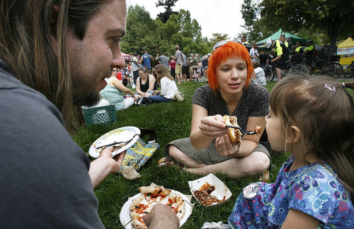 Scott Sommerdorf  |  The Salt Lake Tribune             
Bryan, Michelle and young Morgan Ashby eat lunch on the grass at the opening Saturday of the Salt Lake Farmers Market, Saturday, June 9, 2012.