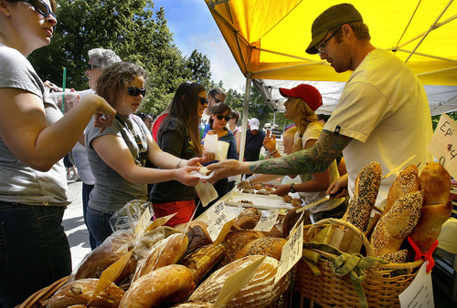 Scott Sommerdorf  |  The Salt Lake Tribune             
The crowd at The Crumb Brothers Bakery stand at the opening Saturday of the Salt Lake Farmers Market, Saturday, June 9, 2012.