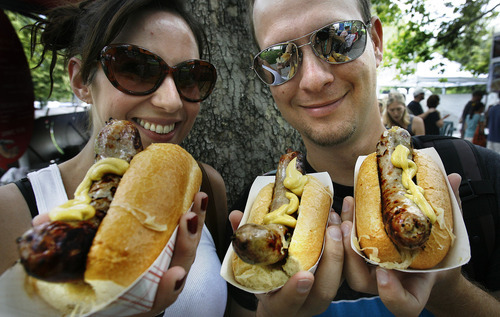 Scott Sommerdorf  |  The Salt Lake Tribune             
Losa and Ben Shirley of Salt Lake are ready to enjoy their Bratwurts from Siegfried's at the opening Saturday of the Salt Lake Farmers Market, Saturday, June 9, 2012.