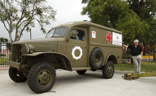 Trent Nelson  |  The Salt Lake Tribune
Fort Douglas Museum Director Robert Voyles with a World War Two-era ambulance Tuesday, June 5, 2012 in Salt Lake City, Utah. The 150th anniversary celebration of Fort Douglas will take place June 16th with a variety of military-themed exhibits including tanks and helicopters.