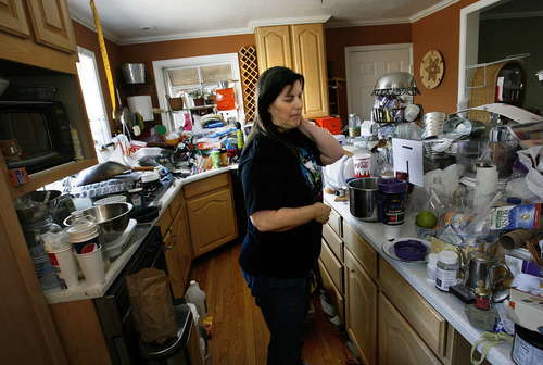 Scott Sommerdorf  |  The Salt Lake Tribune             
K Kay in her kitchen where she explains how she prepares meals usually on a small area of countertop with a sterile piece of waxed paper underneath, Thursday, May 24, 2012.