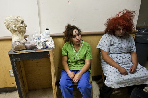 Chris Detrick  |  The Salt Lake Tribune
Actresses Claudia Vidovic 'infected patient' and Victoria Morgas 'insane patient' wait to shoot a scene while making a movie at Castle of Chaos Haunted House during the 48 Hour Film Project Saturday June 9, 2012. Teams of filmmakers get 48 hours to create a movie that is submitted as an entry in the 48 Hour Film Festival.