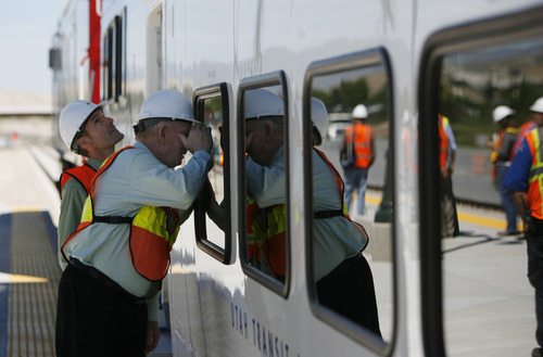 Francisco Kjolseth  |  The Salt Lake Tribune
Lehi City Administrator Derek Todd, left, and Lehi Mayor Bert Wilson get a glimpse inside the first FrontRunner train that arrived in Utah County at the Lehi Station on Monday, June 11, 2012, marking the beginning of the testing process of the new commuter rail line that links Provo to Salt Lake City.