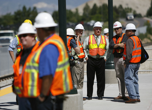 Francisco Kjolseth  |  The Salt Lake Tribune
Lehi Mayor Bert Wilson, third from right, joins other officials, work crews and media for a glimpse of the first FrontRunner train arriving in Utah County at the Lehi Station on Monday, June 11, 2012, marking the beginning of the testing process of the new commuter rail line that links Provo to Salt Lake City.