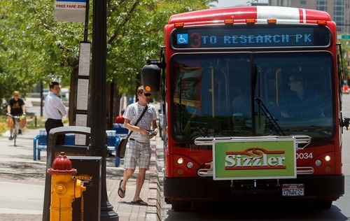 Trent Nelson  |  The Salt Lake Tribune
Passengers board a UTA bus Tuesday, June 12, 2012 in Salt Lake City, Utah.