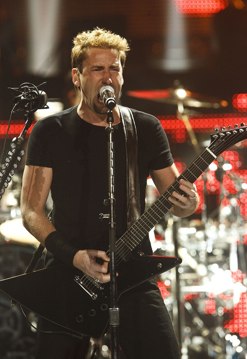 Leah Hogsten  |  The Salt Lake Tribune
Nickelback performs at EnergySolutions Arena on Tuesday, June 12, 2012, in Salt Lake City, featuring Chad Kroeger on vocals and guitar, Ryan Peake on guitar and backing vocals, Mike Kroeger on bass and Daniel Adair on drums and backing vocals.
