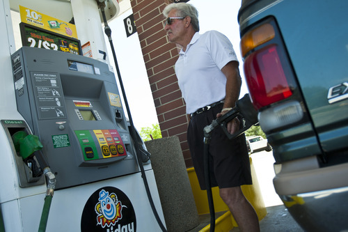Chris Detrick  |  The Salt Lake Tribune
Garry Pennington, of Kamas, fills up his vehicle with gas at Holiday gas station on 12600 South 1300 West in Riverton, Utah Wednesday June 13, 2012.