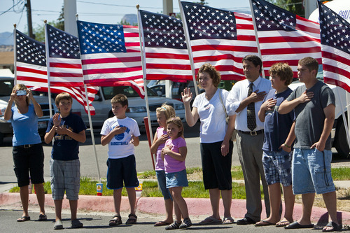 Chris Detrick  |  The Salt Lake Tribune
Locals salute and wave to members of the Utah Army National Guard 624th Engineer Company during a parade along 100 North in Price Tuesday June 12, 2012. Around sixty soldiers from Utah will be deployed for a year to Afghanistan.