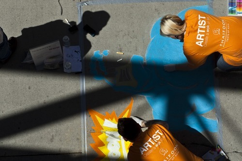 Photo by Chris Detrick | The Salt Lake Tribune 
Megan Anderson, of Midvale, and Bretlen Tomei, of Midvale, draw during the Utah Foster Care Foundation's Annual Chalk Art Festival. This year's festival will be held June 15 and 16, Father's Day weekend, at The Gateway Mall.
