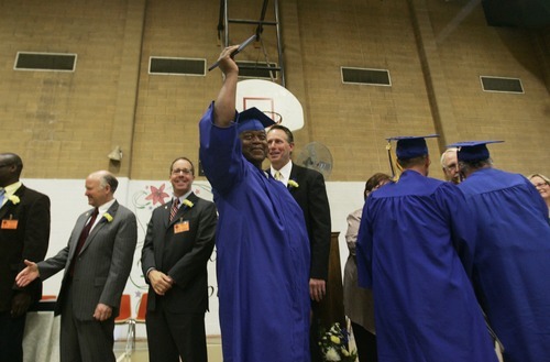 Kim Raff | The Salt Lake Tribune
Johnnie Millsap holds his high school diploma in the air after receiving it at the Utah State Prison in Draper, Utah, during commencement exercises on June 13, 2012. The Utah State Prison and Canyons School District presented diplomas to about 340 men and women who have graduated from the prison's high school or G.E.D. programs.