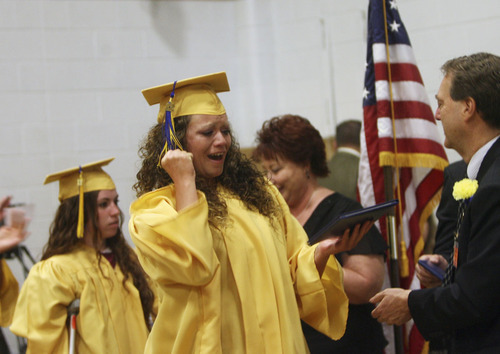 Kim Raff | The Salt Lake Tribune
Jill Shutt from the Timpanogos Women's Facility at the Utah State Prison celebrates after receiving her high school diploma during commencement exercises in Draper, Utah on June 13, 2012. The Utah State Prison and Canyons School District presented diplomas to about 340 men and women who have graduated from the prison's high school or G.E.D. programs.