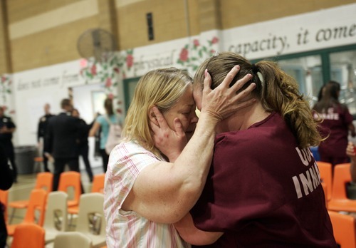 Kim Raff | The Salt Lake Tribune
Inmate Penni Barry (right) hugs her mother Janet Hone after Barry received a high school diploma during commencement exercises at the Utah State Prison in Draper, Utah, on June 13, 2012. The Utah State Prison and Canyons School District presented diplomas to about 340 men and women who have graduated from the prison's high school or G.E.D. programs.