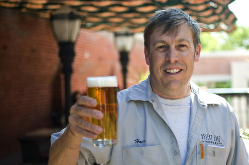 Chris Detrick  |  The Salt Lake Tribune
Brewmaster Chris Haas holds a glass of his Courtney Marie Kölsch at Desert Edge Brewery on Friday, June 8, 2012.