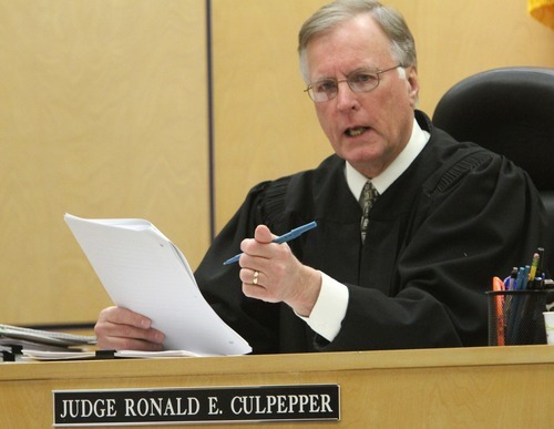Rick Egan  | The Salt Lake Tribune 

Judge Ronald E. Culpepper discusses an issue with the attorneys on the third day of Steve Powell's trial for voyeurism charges in the Pierce County Superior Court in Tacoma, Wash., Wednesday, May 9, 2012.