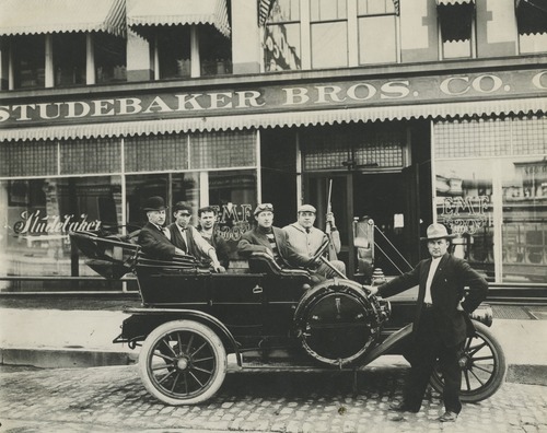 Tribune file photo

A group of men pose with their car in downtown Salt Lake City in this undated photo.