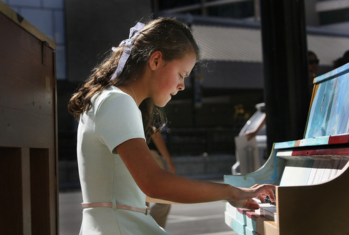 Scott Sommerdorf  |  The Salt Lake Tribune             
Sarah Shipp, Salt Lake City, plays one of the painted pianos to be displayed around downtown for the urban art installation 