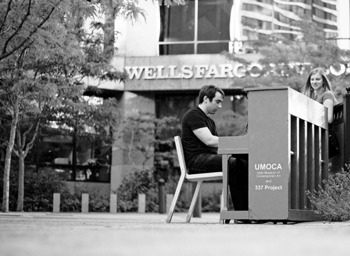 Kim Raff | The Salt Lake Tribune
Erin Page watches as Doug Vandegrift plays a piano installed at the Gallivan Center downtown as part of Utah Museum of Contemporary Art's  