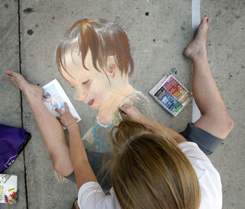 Rick Egan  | The Salt Lake Tribune 

Mary E. Jensen draws a picture of her niece, at the Utah Foster Care Foundation's Annual Chalk Art Festival, at the Gateway in Salt Lake City, Friday, June 15, 2012.  The festival continues through Saturday.