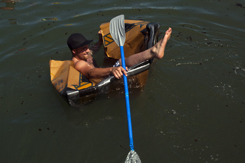 Chris Detrick  |  The Salt Lake Tribune
Zack Silver competes in a cardboard boat race during The Great Salt Lake Yacht Club's SailFest Saturday June 16, 2012.  SailFest is an annual event hosted by the club, established in 1877.