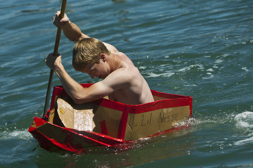 Chris Detrick  |  The Salt Lake Tribune
Chance Boekweg, of Tooele, competes in a cardboard boat race during The Great Salt Lake Yacht Club's SailFest Saturday June 16, 2012.  SailFest is an annual event hosted by the club, established in 1877.