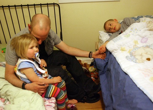 Kim Raff | The Salt Lake Tribune
Dov Siporin tells his children Siena and Matan a story while putting them to bed. Siporin has terminal colon cancer, but he continues painful treatment to prolong his life as long as he can. 
