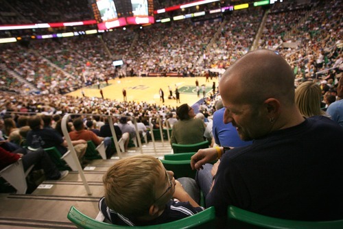 Kim Raff | The Salt Lake Tribune
Dov Siporin and son Matan go to a Utah Jazz basketball game in Salt Lake City. Siporin received the tickets through the Huntsman Cancer Institute. He was featured during the game for his positive attitude throughout his disease.