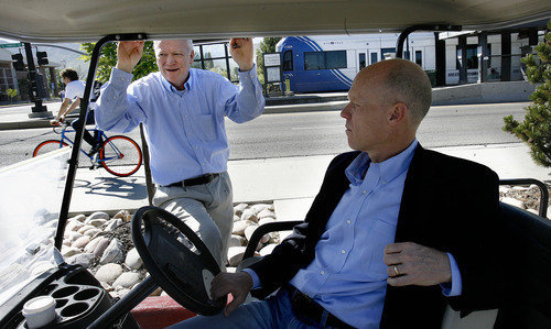 Scott Sommerdorf  |  The Salt Lake Tribune             
Alma Allred, director of Comunity Services at the U., left, and Wesley Smith, CEO of a Utah State startup called WAVE, are collaborating in the commercialization of technology that wirelessly transfers electric power. WAVE is building a demonstration project on the University of Utah campus that will charge electric shuttle buses without wires. Using a $2.7 million federal grant, the company will install the charging pads this summer and by winter, the U. will be operating a bus between the south campus TRAX station and the Warnock engineering complex. Monday, May 14, 2012.