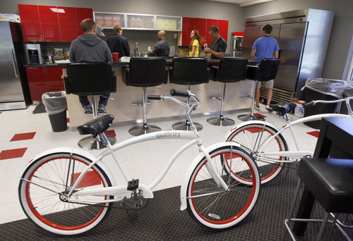 Francisco Kjolseth  |  The Salt Lake Tribune
Employees at software company Qualtrics in Provo, gather at one of the company's snack bars where office bikes are also available on Monday, June 11, 2012. The company which makes online survey software recently got $70 million in first round venture capital and are a hot company growing in Utah county.