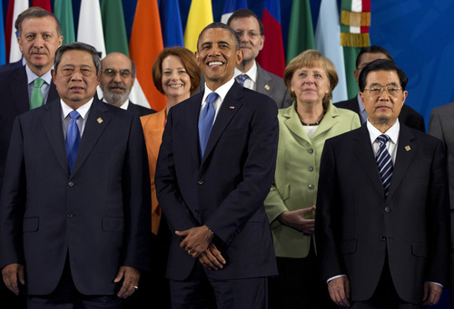 President Barack Obama takes his place with other leaders for the Family Photo during the G20 Summit, Monday, June 18, 2012, in Los Cabos, Mexico. From left, Turkish Prime Minister Recep Tayyip Erdogan, Indonesian President Susilo Bambang Yudhoyono, Jose Graziano da Silva, Australian Prime Minister Julia Gillard, U.S. President Barack Obama, Spanish Prime Minister Mariano Rajoy, German Chancellor Angela Merkel, Chinese President Hu Jintao. (AP Photo/Carolyn Kaster)
