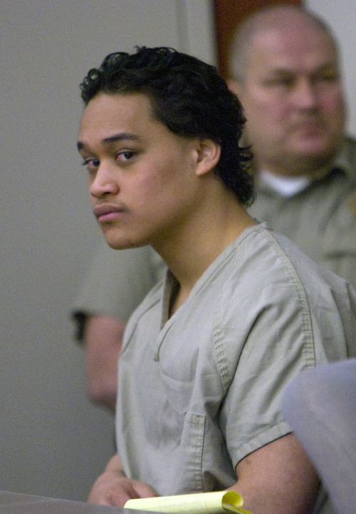 Al Hartmann   |  Tribune file photo
Ricky Angilau sits at defense table in Judge Ann Boyden's courtroom in Third District Court on April 15 for a preliminary hearing. He is charged with murder for shooting classmate Esteban Saidi near Kearns High School on Jan. 21, 2009.