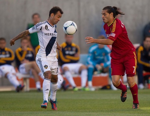 Trent Nelson  |  The Salt Lake Tribune
RSL's Fabian Espindola, right, and L.A.'s Juninho go for the ball as Real Salt Lake hosts the L.A. Galaxy at Rio Tinto Stadium on Wednesday, June 20, 2012, in Sandy.