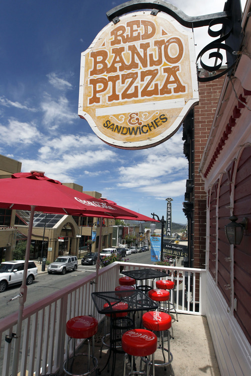 Al Hartmann  |  The Salt Lake Tribune 
The Red Banjo Pizza Parlour's upstari patio has one of the best views over Park City's Main Street. The restaurant's 50th birthday celebration will take place Sunday.